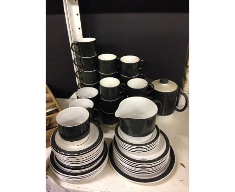 The residue of a Poole Pottery Branksome tea service in charcoal glaze.