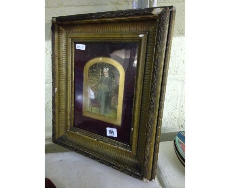 A framed and glazed 19th century photographic portrait: Woman in garden by chair.