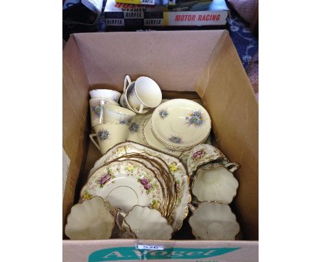 An early 20th century Melba bone china teaset decorated with Violets together with an Art Deco Thomas Hughes china teaset dec