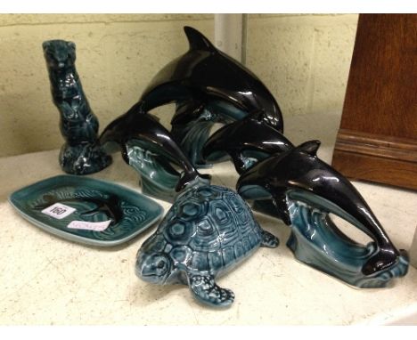 Seven various blue glazed Poole Pottery items.