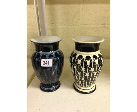 Two Poole Pottery hand painted vases, thrown by Alan Clarke, decorated in modern designs.