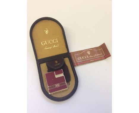 A Gucci Accessory Collection cigarette lighter in original case (worn).