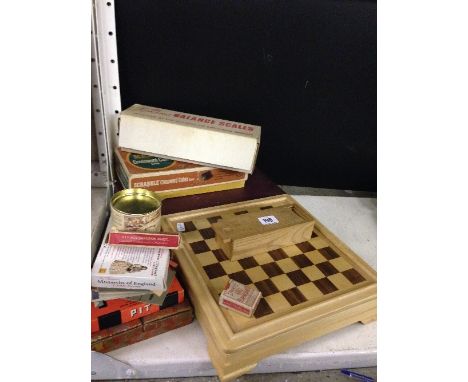 A collection of various games together with The Gourmet Balance Scales.