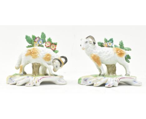 Chelsea Porcelain - A pair of 18th century hand painted porcelain figures of rams. Each having an intricately detailed trees 