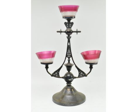 An Art Nouveau, manner of Liberty of London early 20th century quadruple silver plated &amp; cranberry glass centrepiece eper