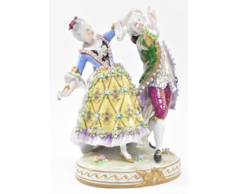 Sitzendorf - An early 20th century porcelain figural group depicting a Regency couple dancing. Each with fine relief flower d