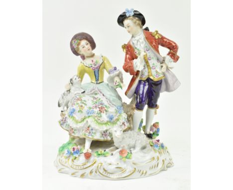 An early 20th century Sitzendorf German porcelain figurine of a courting Regency couple. The gent depicted in dandy clothing,