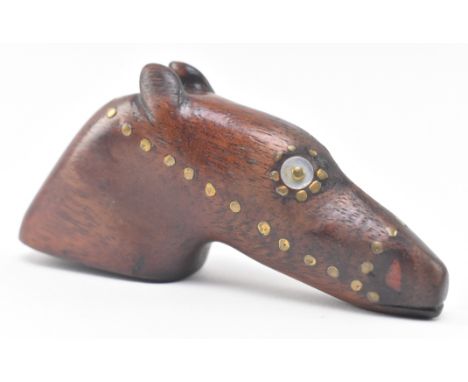 A naive early 19th century treen inlay snuff box. The wooden snuff in the form of a greyhound dog head decorated with brass m