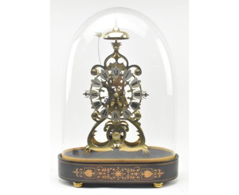 An early 20th century brass single fusee movement skeleton mantel clock in glass dome. The clock having chiming bell atop ove