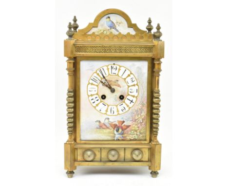 A late 19th century French mantel clock. The 8-day movement clock with porcelain dial within a decoratice case featuring pedi