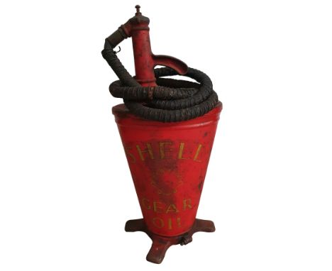 A Shell gear oil pump, with original clam logo and pipe work, height 68 cm.