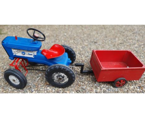Triang, a child's tractor, with home built trailer.