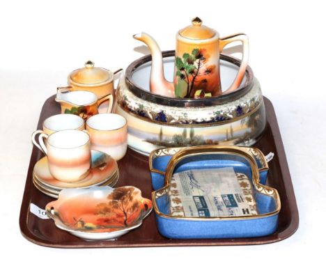 A small group of Noritake including a peacock basket; silver rimmed bowl decorated with Swans in a river landscape; a coffee 