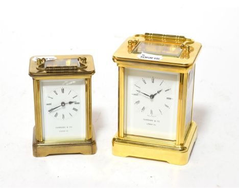 A brass striking carriage clock, retailed by Garrard &amp; Co, and a brass carriage timepiece retailed by Garrard &amp; Co (2