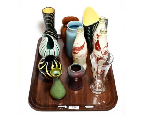 Three empty Coca Cola bottles with Manolo Blahnik and Trevor Nelson wraps, Becks glass printed with Damien Hirst dots, two As