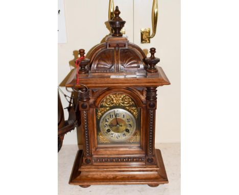 A late 19th century walnut striking mantel clock, movement stamped Junghans