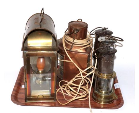 A Bedlington miners lamp, two Eccles miners lamps, a ships copper lamp and a brass lamp (5)