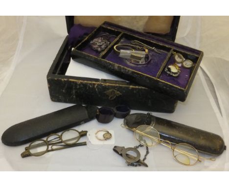 A pair of brass framed spectacles, a pair of gold framed spectacles in silver mounted case a pair of early 20th Century ivory