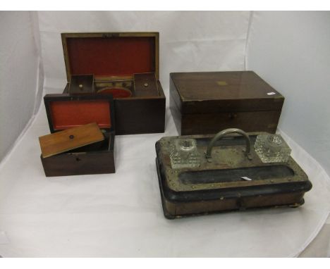 A 19th Century rectangular mahogany tea caddy, the hinged lid opening to reveal two mahogany lidded compartments and central 