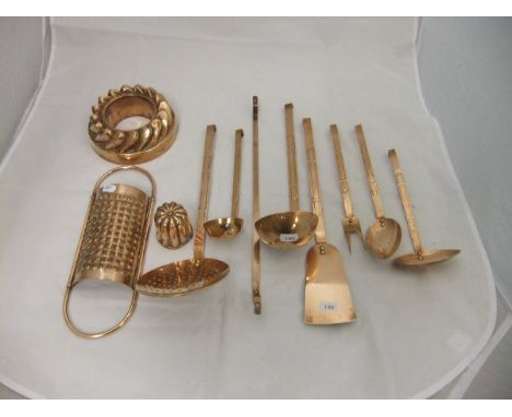 A collection of 19th Century and later copper kitchen wares to include a ring jelly mould, cheese grater, ladles, skimmer, et