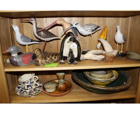 A collection of eleven various painted wooden bird figures in the manner of Michael Lythgoe, a collection of modern chinaware