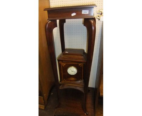 A square mahogany jardinier stand, the hipped cabriole legs united by an undertier and a Sphinx smoker's clock with mahogany 