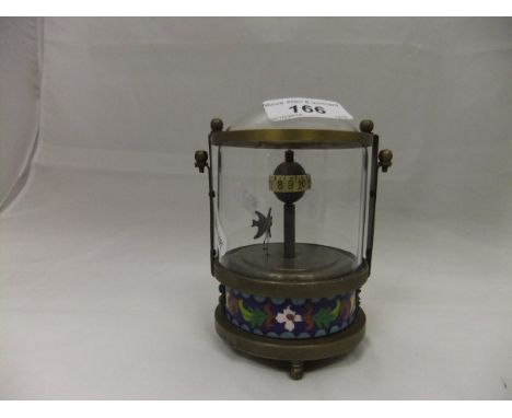 A brass mounted automaton clock with cloisonné decorated base