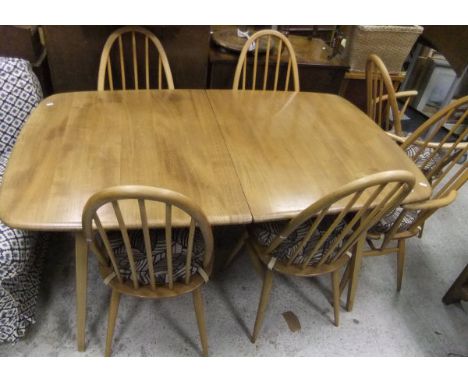 An Ercol extending dining table and six stick back chairs CONDITION REPORTS Table approx 90cm wide, 152cm long.  Items have g