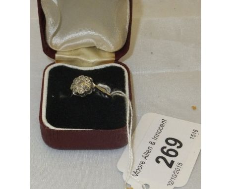 An 18 carat gold diamond cluster ring of flower head form CONDITION REPORTS Size 0/P. Some general wear and scuffs.