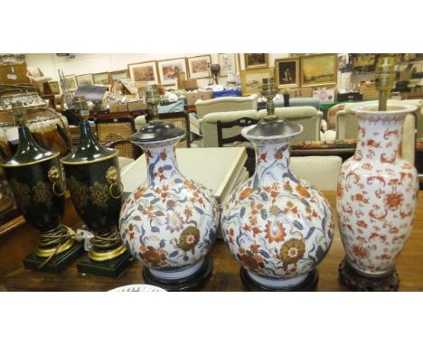 A pair of Oriental style baluster shaped table lamp bases, a further Oriental style table lamp base, a pair of urn shaped tab