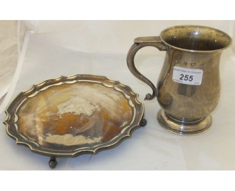 A large silver baluster shaped mug raised on stepped circular foot (Birmingham 1976), and a modern silver salver with pie cru