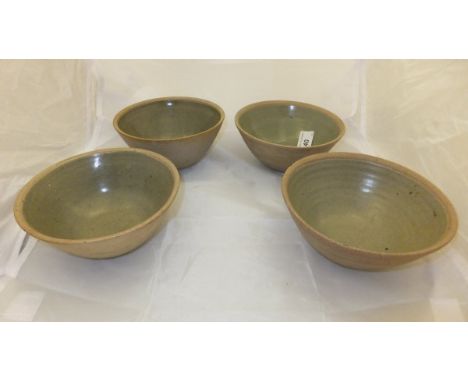A set of four  1960's Bernard Leach St. Ives Pottery celadon glazed bowls with impressed mark