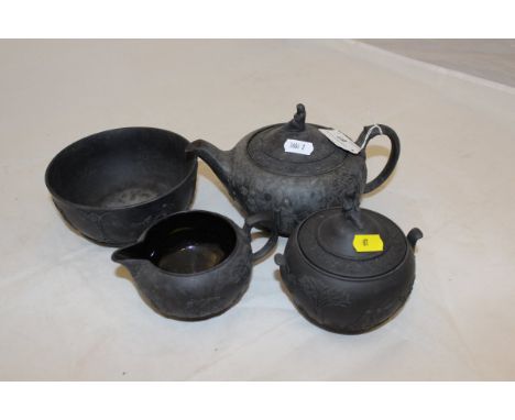 A 20th Century Wedgwood black basalt teapot and lidded sucrier with similar cream jug and slop bowl CONDITION REPORTS They ha