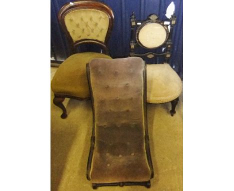 A late Victorian ebonised framed salon chair, an oak framed button back salon chair and an ebonised framed nursing chair