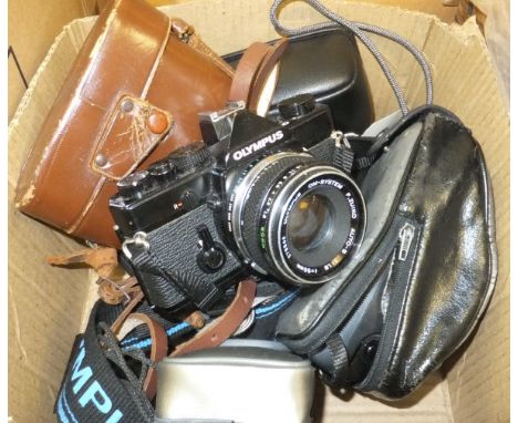 A box of assorted cameras to include Pal M4, Canon AF35 ML, and an Olympus OM1 CONDITION REPORTS No cameras are checked for w