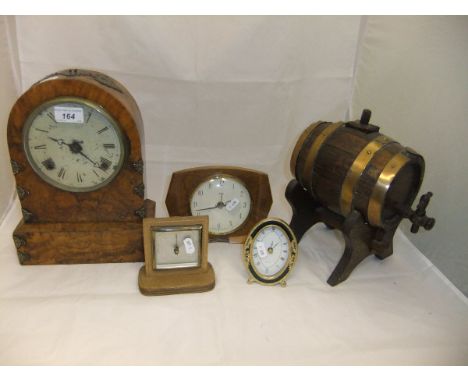 A late 19th Century walnut cased dome topped mantel clock with decorative brass mounts, the cream painted dial bearing Roman 