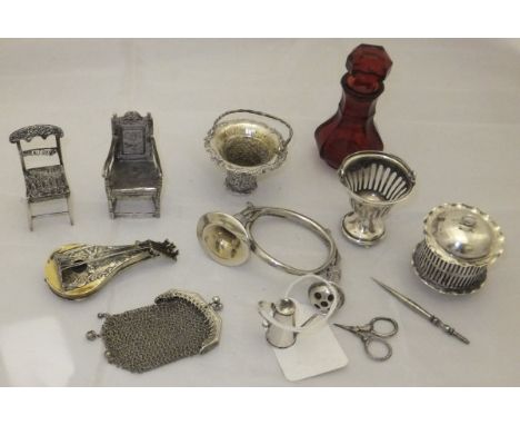 A collection of miniature silver and other items to include two miniature Dutch silver chairs, two miniature pedestal baskets