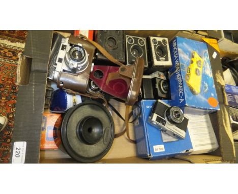 A Brownie Six-20 camera model C, a 77X instamatic camera, together with various other cameras