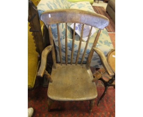 A circa 1900 beech and elm stick back Windsor carver armchair