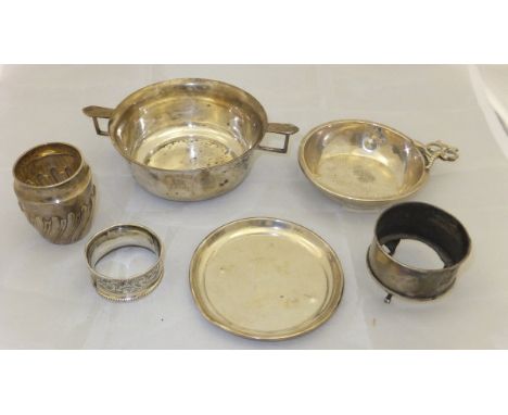 A twin-handled silver porringer bearing initials "J C A" to front (Birmingham 1929), a white metal cup stamped "Sterling" to 