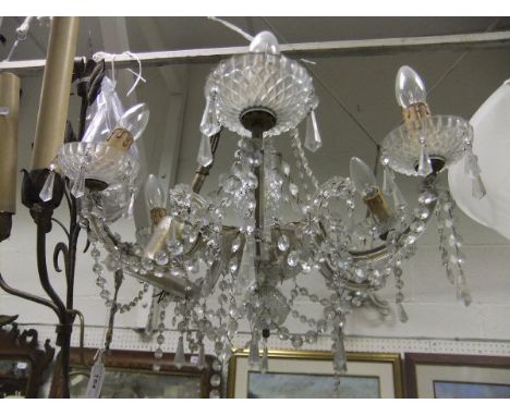 A Venetian style glass electrolier with cut glass swags and clear cut glass drops, the body with baluster shaped pineapple cu