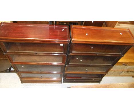 A pair of early 20th Century mahogany four tier Globe Wernicke bookcases