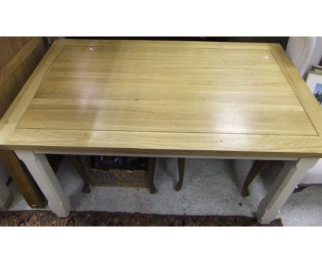 A modern rectangular Shaker style light oak topped kitchen table with cream painted legs