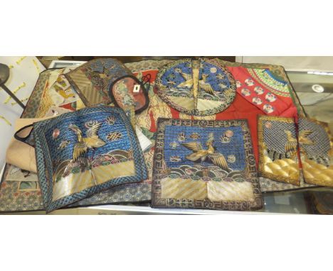 A collection of various Chinese and other silkwork panels, to include early 20th Century and later rank badges / robe panels 