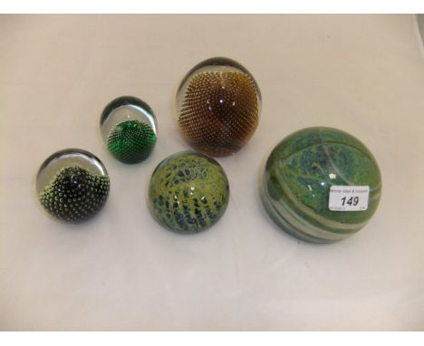 A large Mdina glass paperweight, a smaller version, and three Whitefriars paperweights with internal bubble pattern (5) CONDI