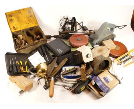 An assortment of tools, to include, a cut-all saw, tape measures, and a workshop electric multi-tool, housed in four boxes. (