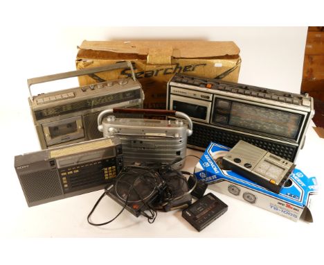 A collection of vintage radios. walkmens and a disc player, together with a Sharp 'The Searcher' ghetto blaster, in box.