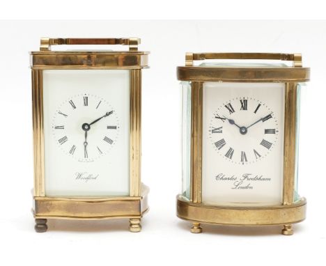 Two mid to late twentieth century brass carriage clocks, housing eight day movements, to include, an oval Charles Frodsham, L