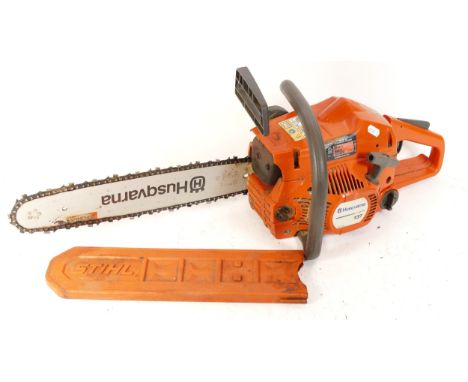 A Husqvarna 137 petrol driven chainsaw.