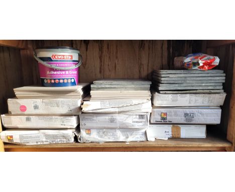 Nine boxes of ceramic floor tiles along with a quantity of loose tiles all with various designs, a tub of adhesive and grout,